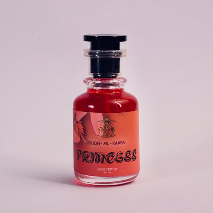 Small bottle with red liquid on a light gray background